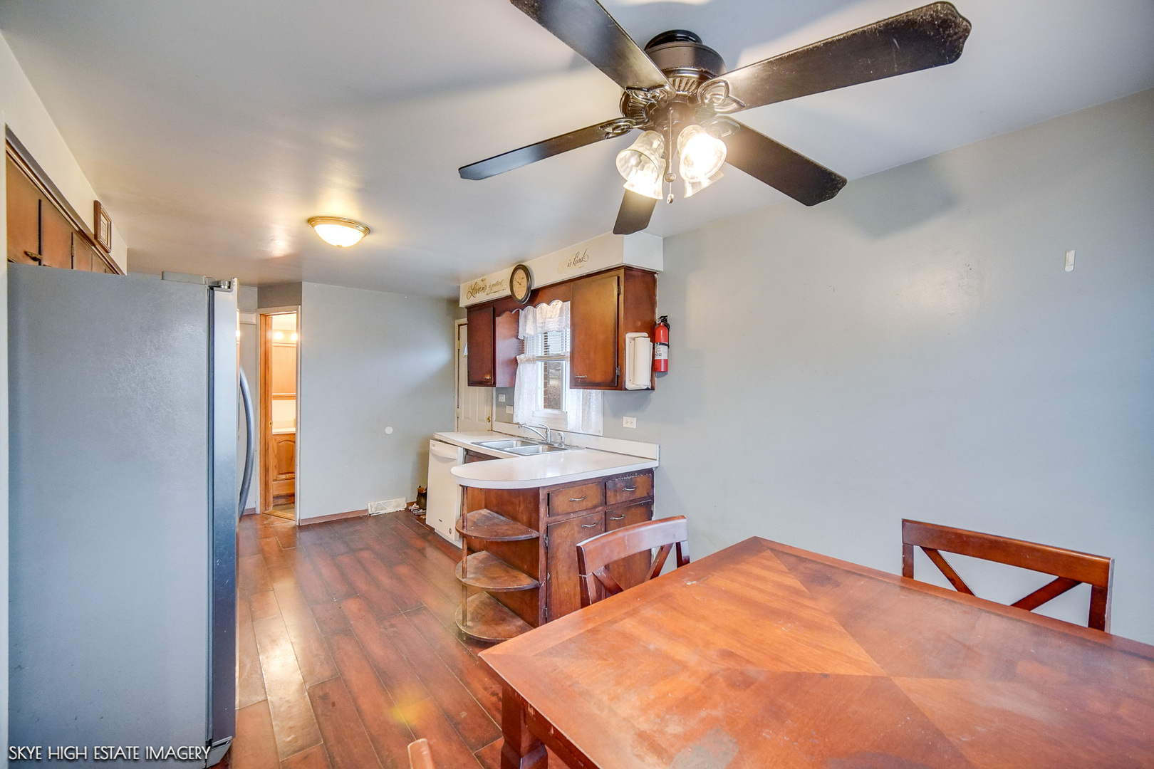 14850 Homan Avenue Midlothian, IL 60445 - Photo 3 of 13 a view of a workspace with furniture and a chandelier fan