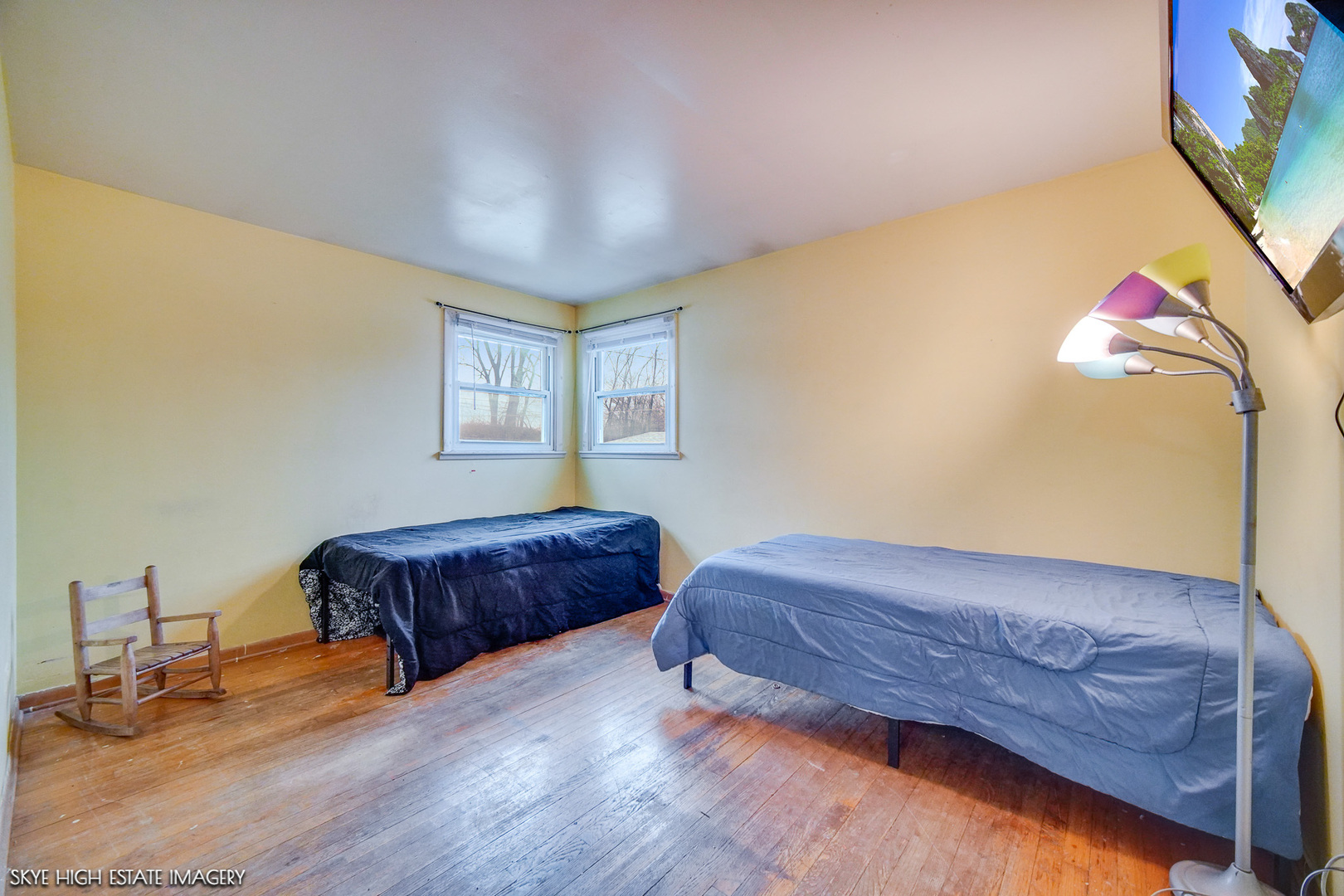 14850 Homan Avenue Midlothian, IL 60445 - Photo 7 of 13 a bedroom with a bed and a potted plant on dresser
