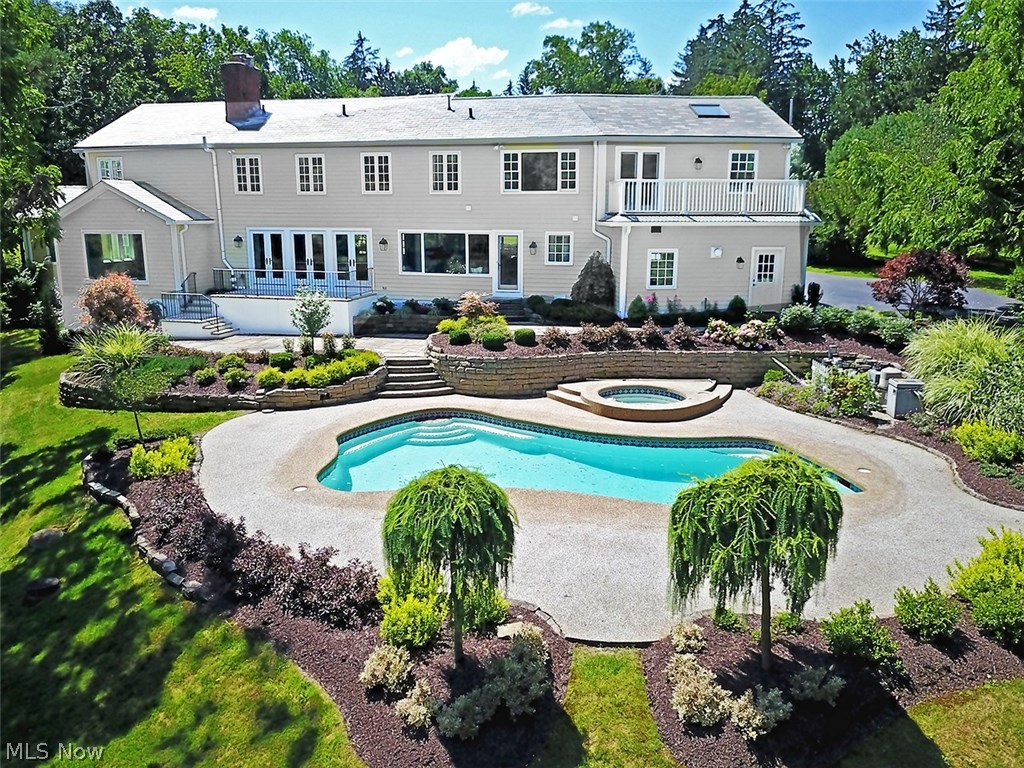 34055 Old Kinsman Road Hunting Valley, OH 44022 - Photo 30 of 32 Stone walls and manicured gardens around the free-form pool, hot tub and patios add a sense of quality and refinement. It's like being on vacation in your own backyard.