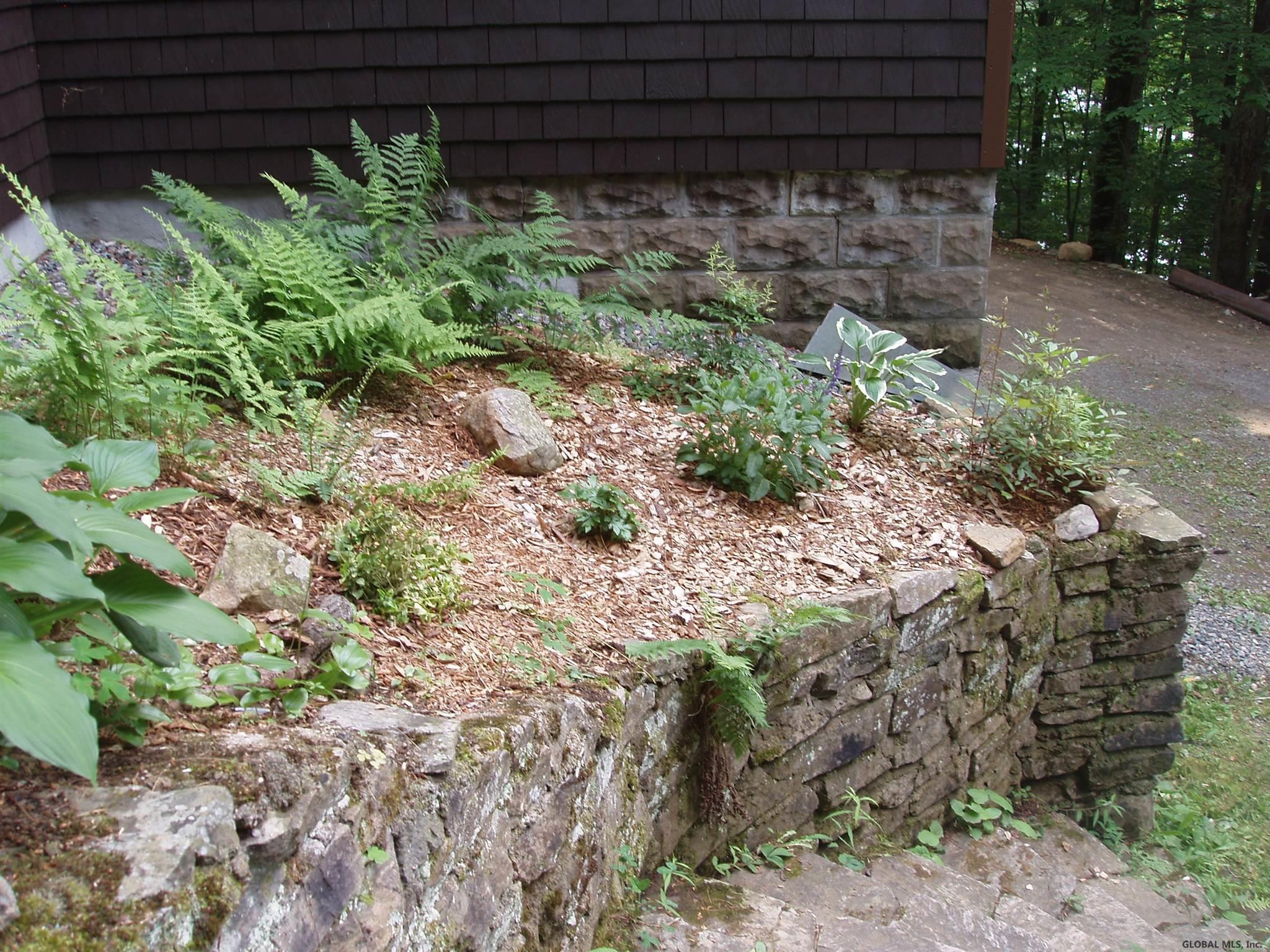 1817 North Shore Road Day, NY 12835 - Photo 36 of 46 Stone walls and steps surround the home