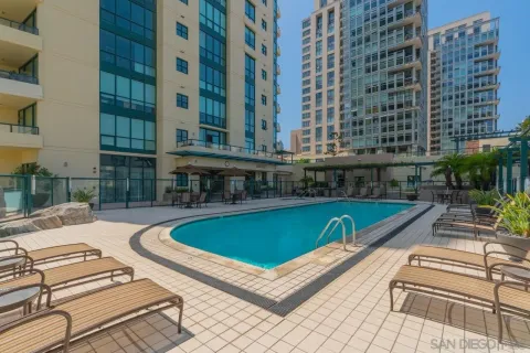 a view of a swimming pool with outdoor seating
