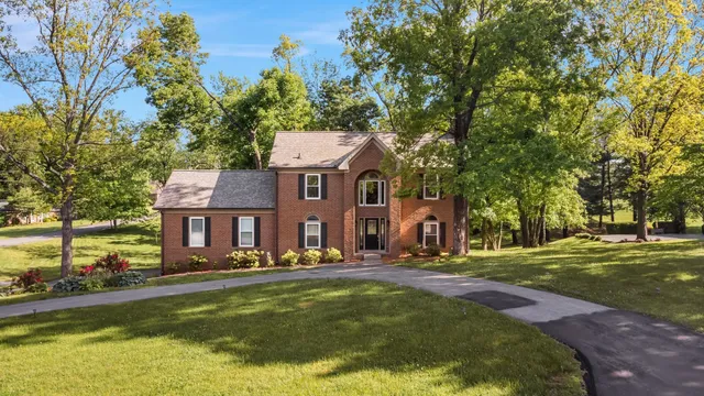 a front view of a house with a yard table and chairs