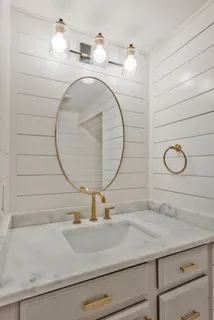 a bathroom with a sink and mirror