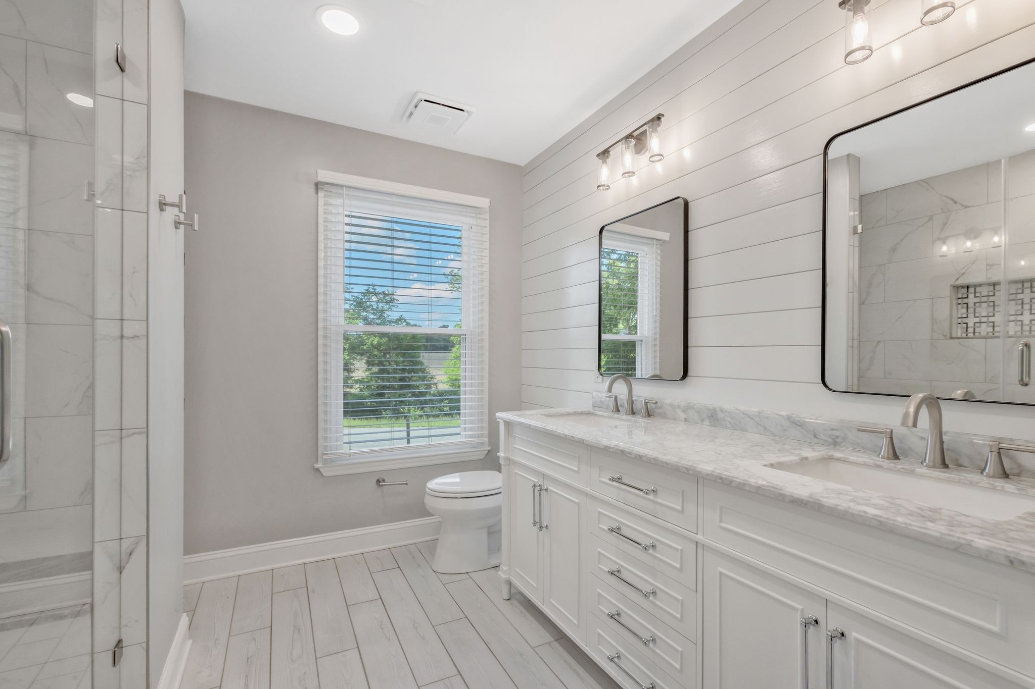 3508 Forest Park Road Springfield, TN 37172 - Photo 19 of 45 a bathroom with a granite countertop sink a toilet a mirror and window