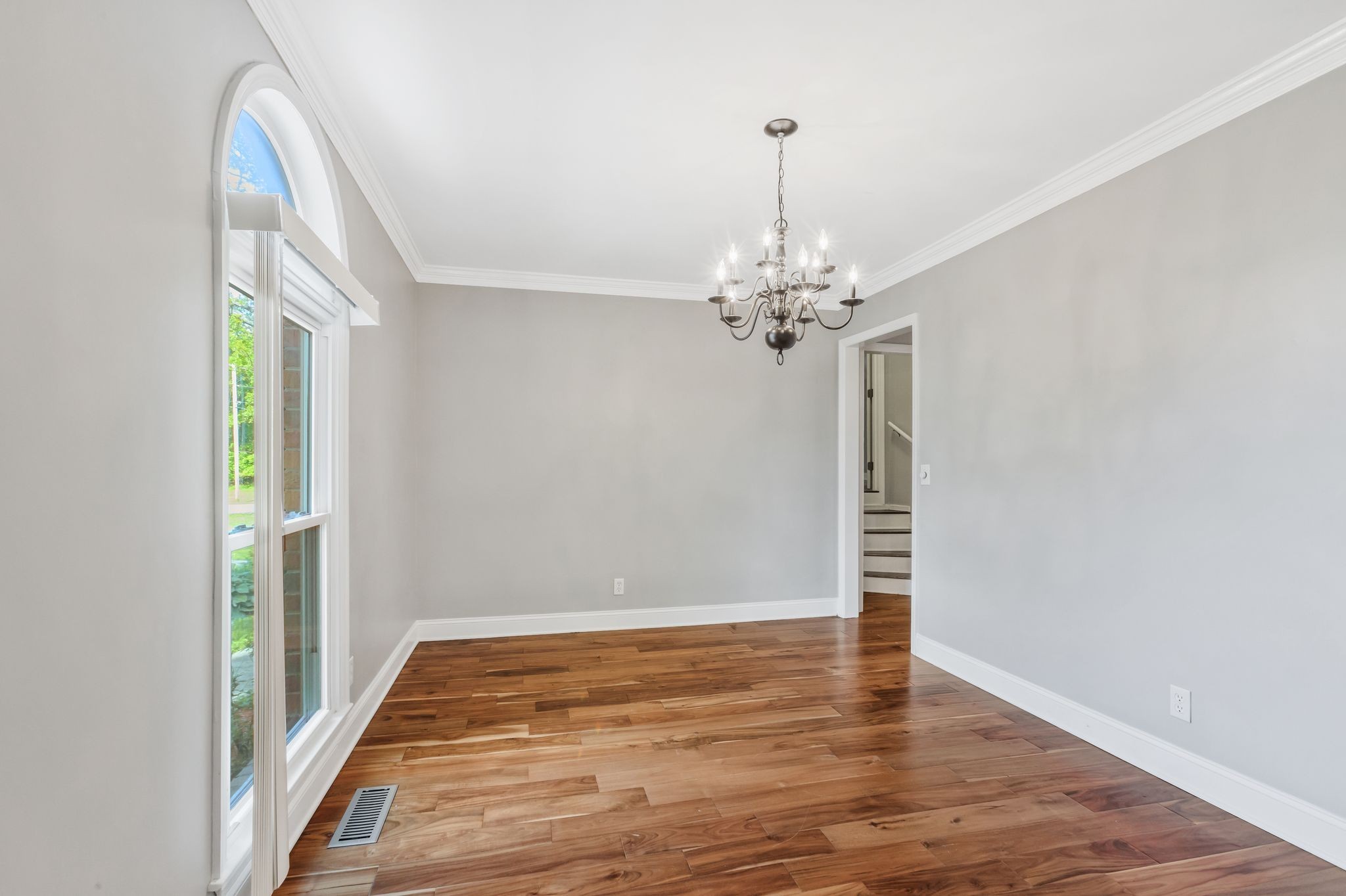 3508 Forest Park Road Springfield, TN 37172 - Photo 24 of 45 a view of a chandelier in hallway with wooden floor and chandelier