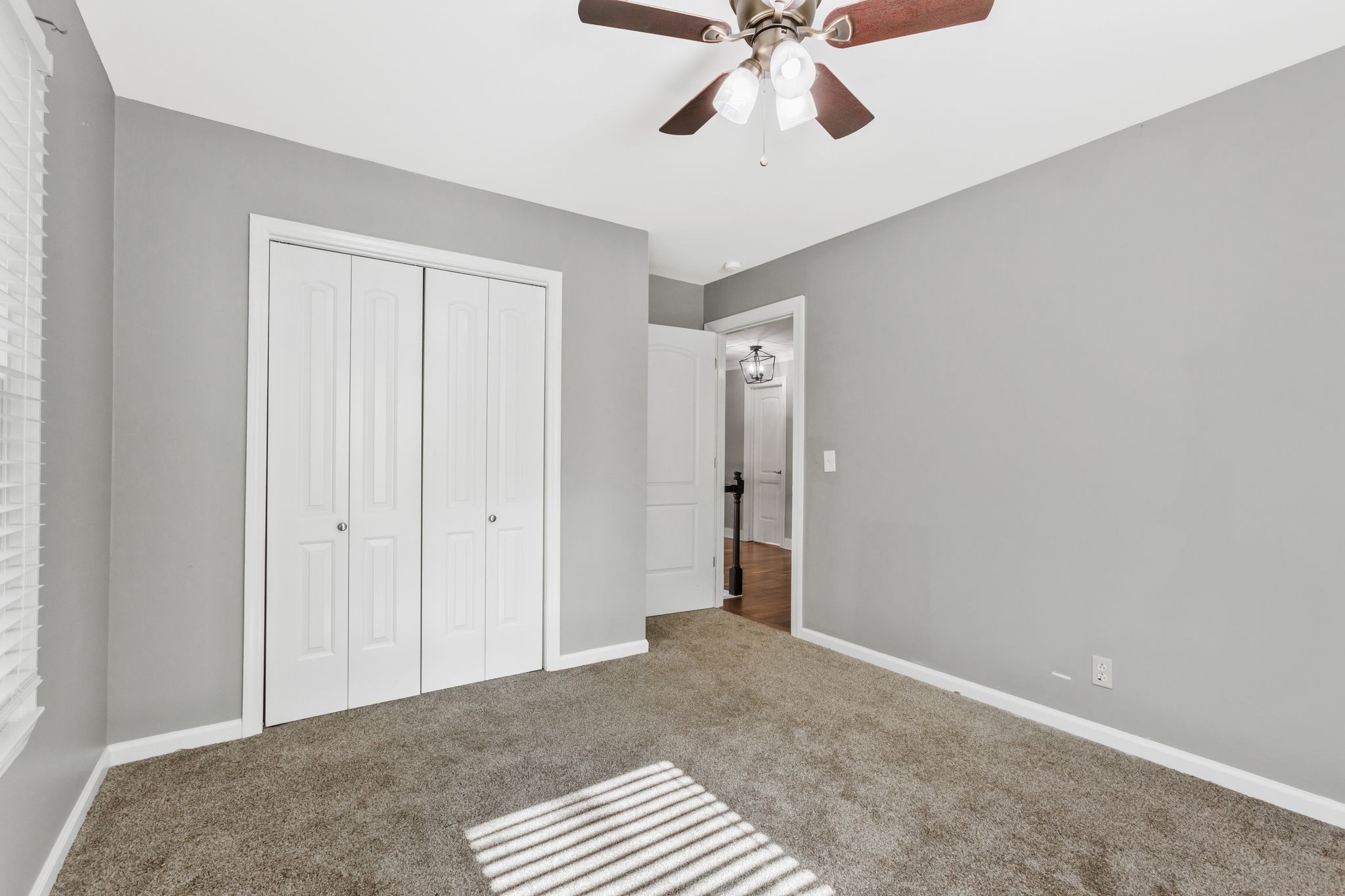 3508 Forest Park Road Springfield, TN 37172 - Photo 28 of 45 a bedroom with a bed and a chandelier fan
