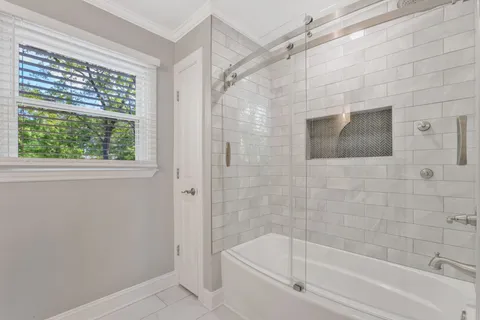 a bathroom with a shower and bathtub