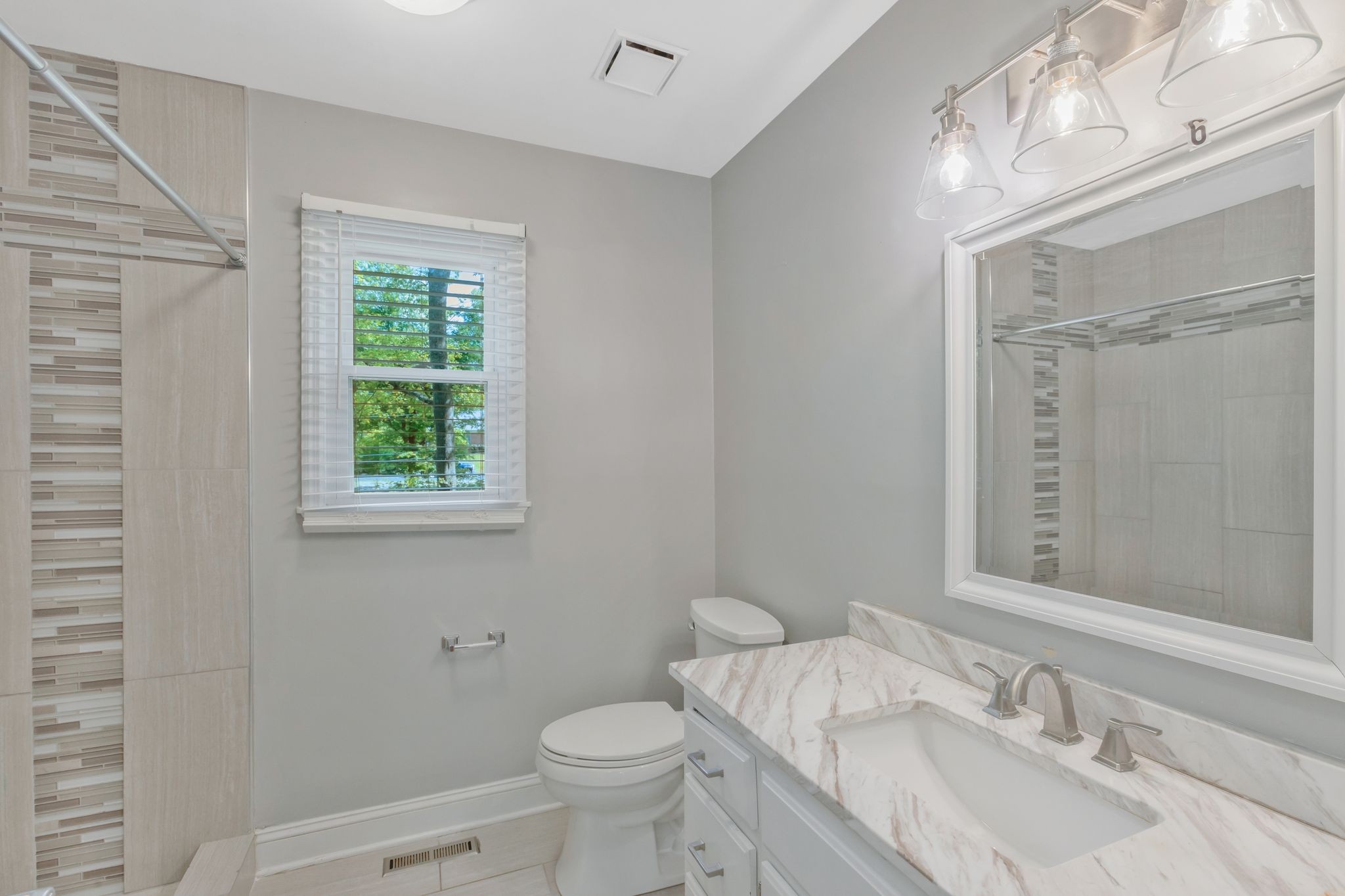 3508 Forest Park Road Springfield, TN 37172 - Photo 30 of 45 a bathroom with a granite countertop sink toilet and shower