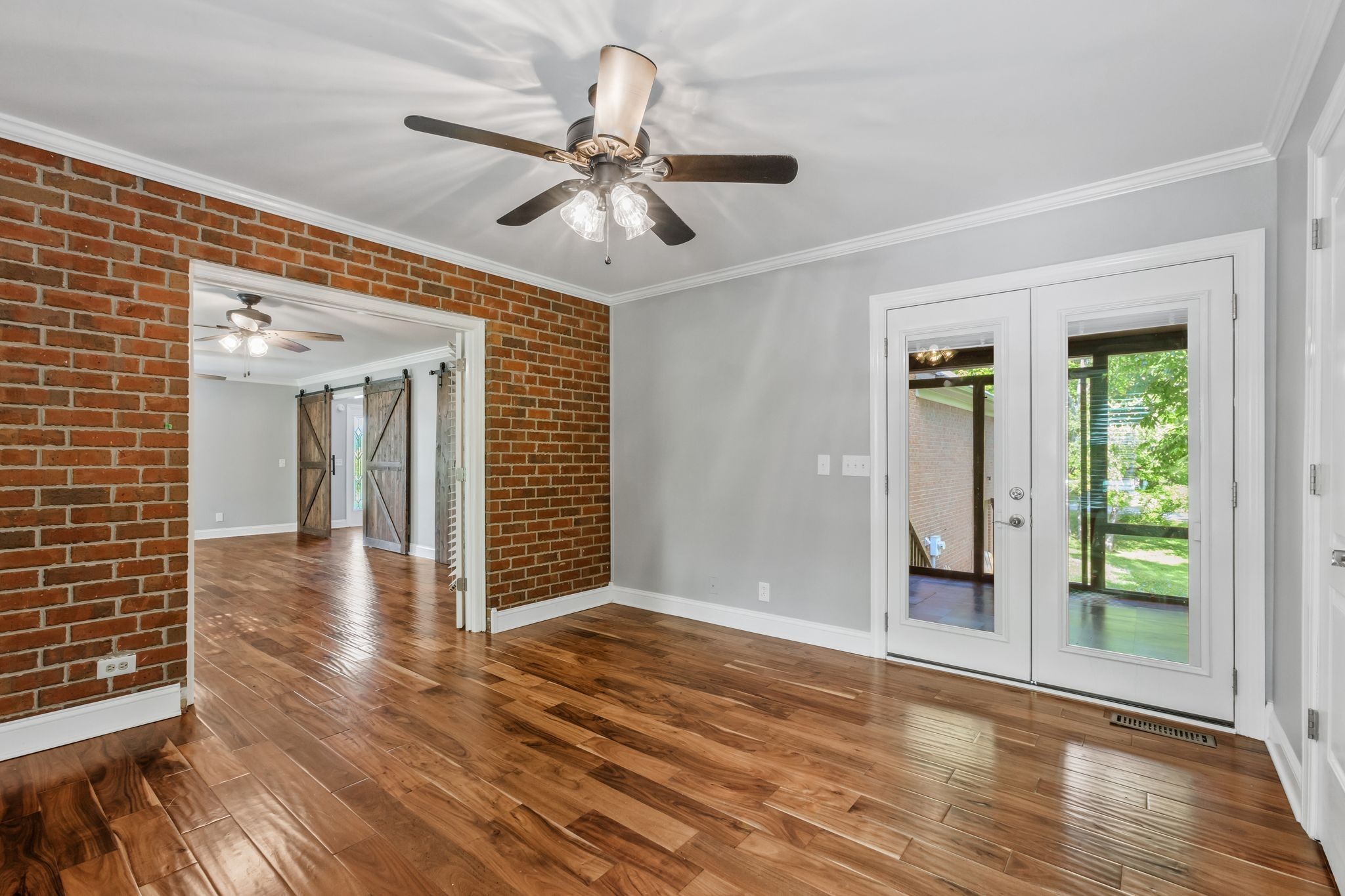 3508 Forest Park Road Springfield, TN 37172 - Photo 35 of 45 a view of a livingroom with wooden floor and a ceiling fan