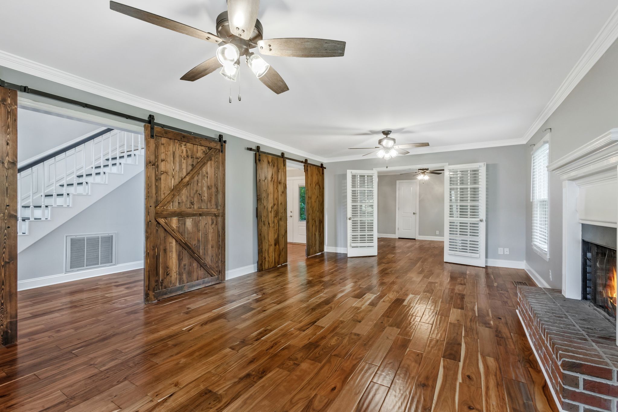 3508 Forest Park Road Springfield, TN 37172 - Photo 7 of 45 a view of an empty room with wooden floor fireplace and a window