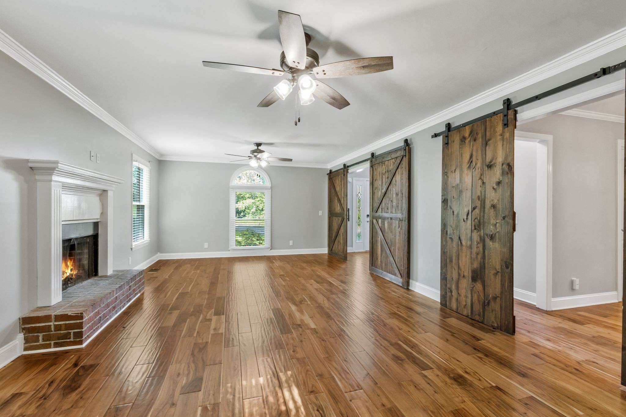 3508 Forest Park Road Springfield, TN 37172 - Photo 8 of 45 a view of an empty room with wooden floor fireplace and a window