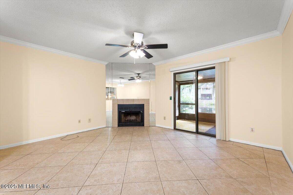 3801 Crown Point Road, Unit 3073 Jacksonville, FL 32257 - Photo 15 of 26 an empty room with windows and fireplace