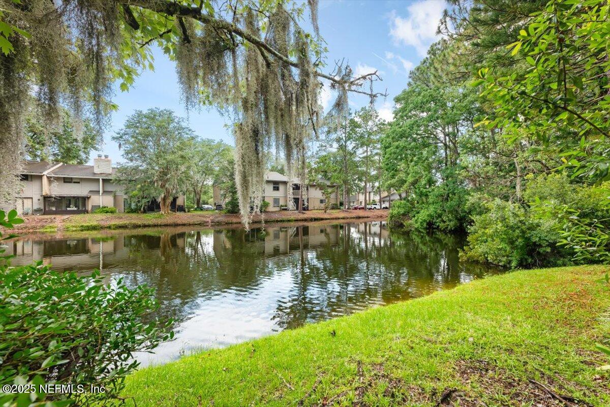 3801 Crown Point Road, Unit 3073 Jacksonville, FL 32257 - Photo 5 of 26 a view of a lake with a building in the background