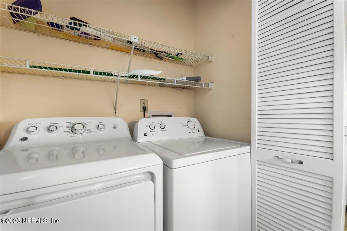 3801 Crown Point Road, Unit 3073 Jacksonville, FL 32257 - Photo 10 of 26 a utility room with dryer and washer