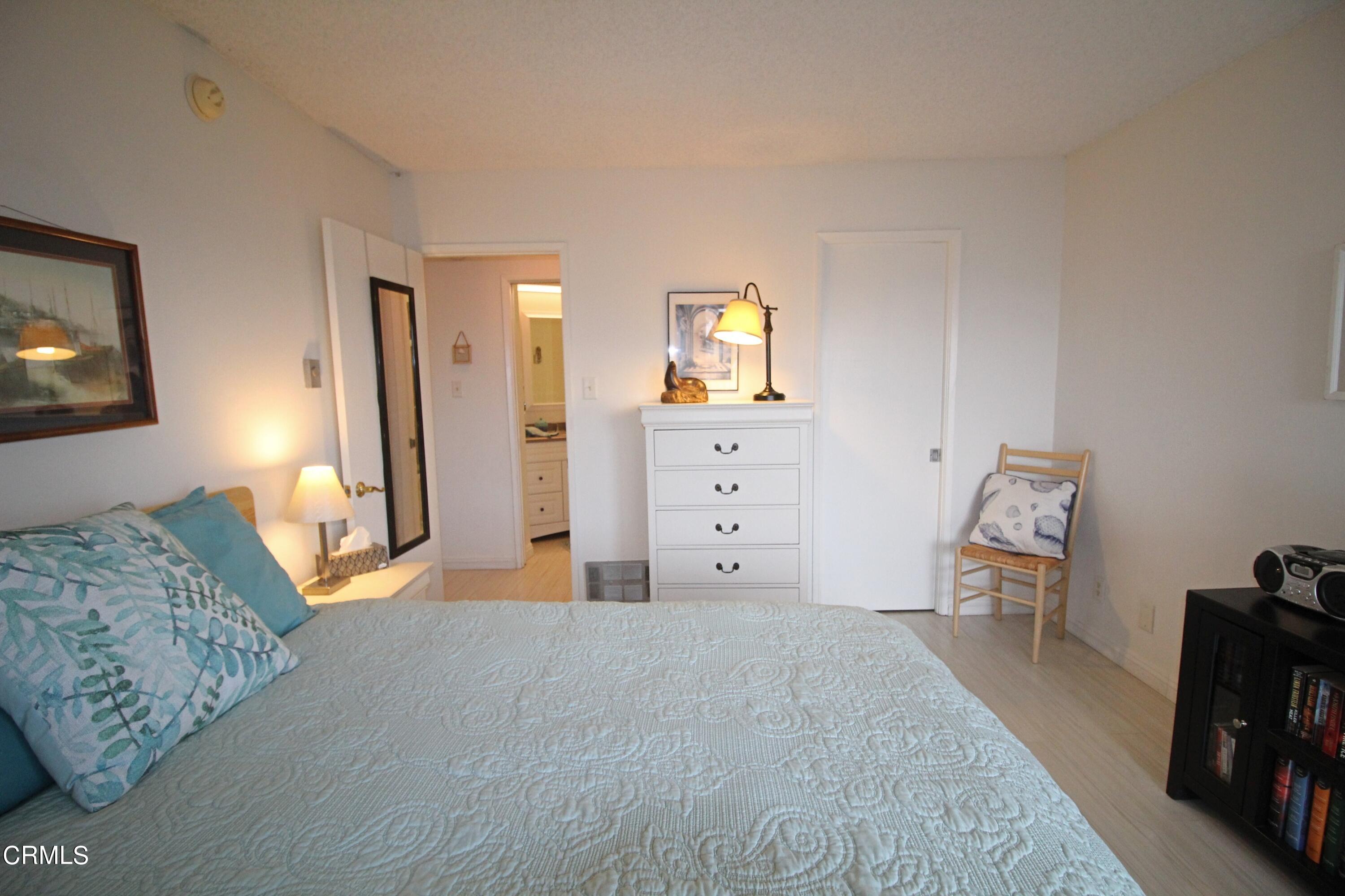 3101 Peninsula Road, Unit 312 Oxnard, CA 93035 - Photo 15 of 26 a bedroom with a bed and a television
