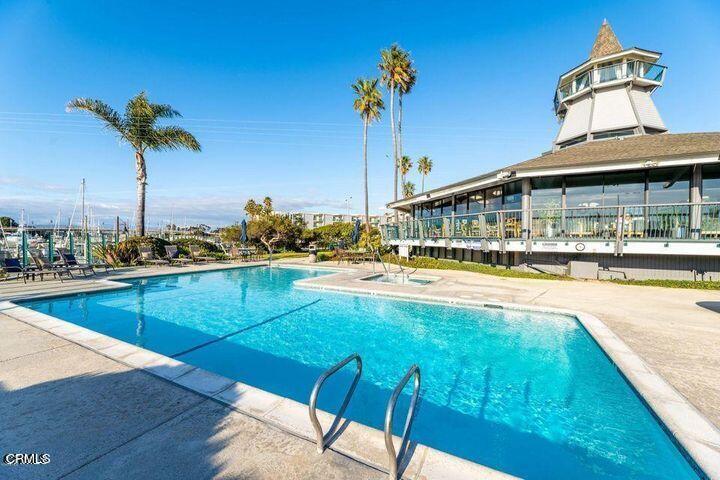 3101 Peninsula Road, Unit 312 Oxnard, CA 93035 - Photo 24 of 26 a view of a swimming pool with an outdoor seating