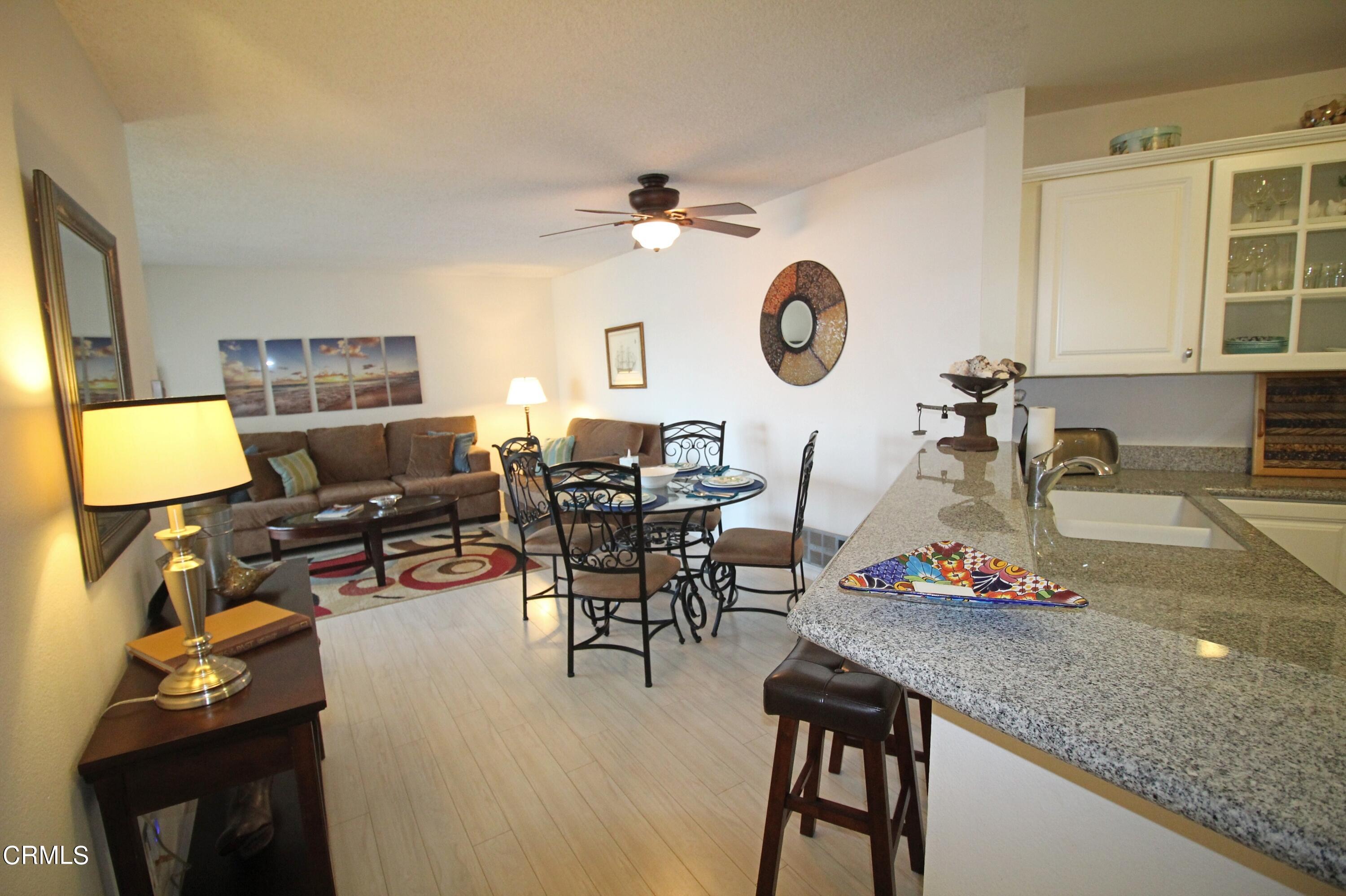 3101 Peninsula Road, Unit 312 Oxnard, CA 93035 - Photo 6 of 26 a room with gym equipment and view of living room