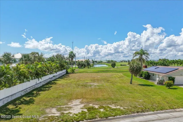 a view of a swimming pool with a yard