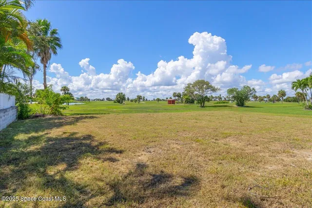 a view of a fountain in a big yard