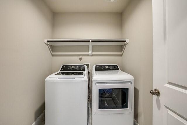 5912 Bursey Road Watauga, TX 76148 - Photo 15 of 23 Laundry area featuring independent washer and dryer and baseboards