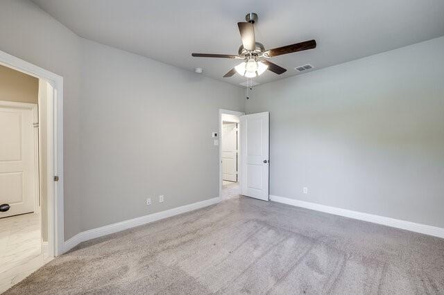 5912 Bursey Road Watauga, TX 76148 - Photo 18 of 23 Empty room with a ceiling fan, carpet floors, and baseboards