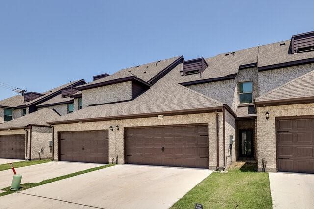 5912 Bursey Road Watauga, TX 76148 - Photo 21 of 23 View of front of property featuring a shingled roof, driveway, and brick siding