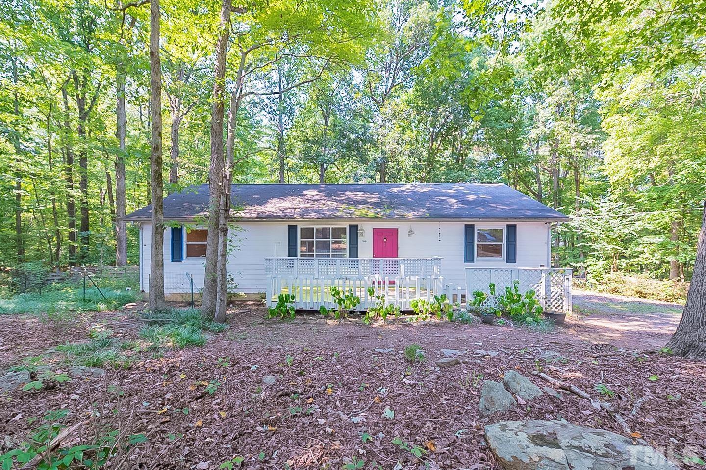7005 Russell Road Durham, NC 27712 - Photo 1 of 24 front view of a house with a yard