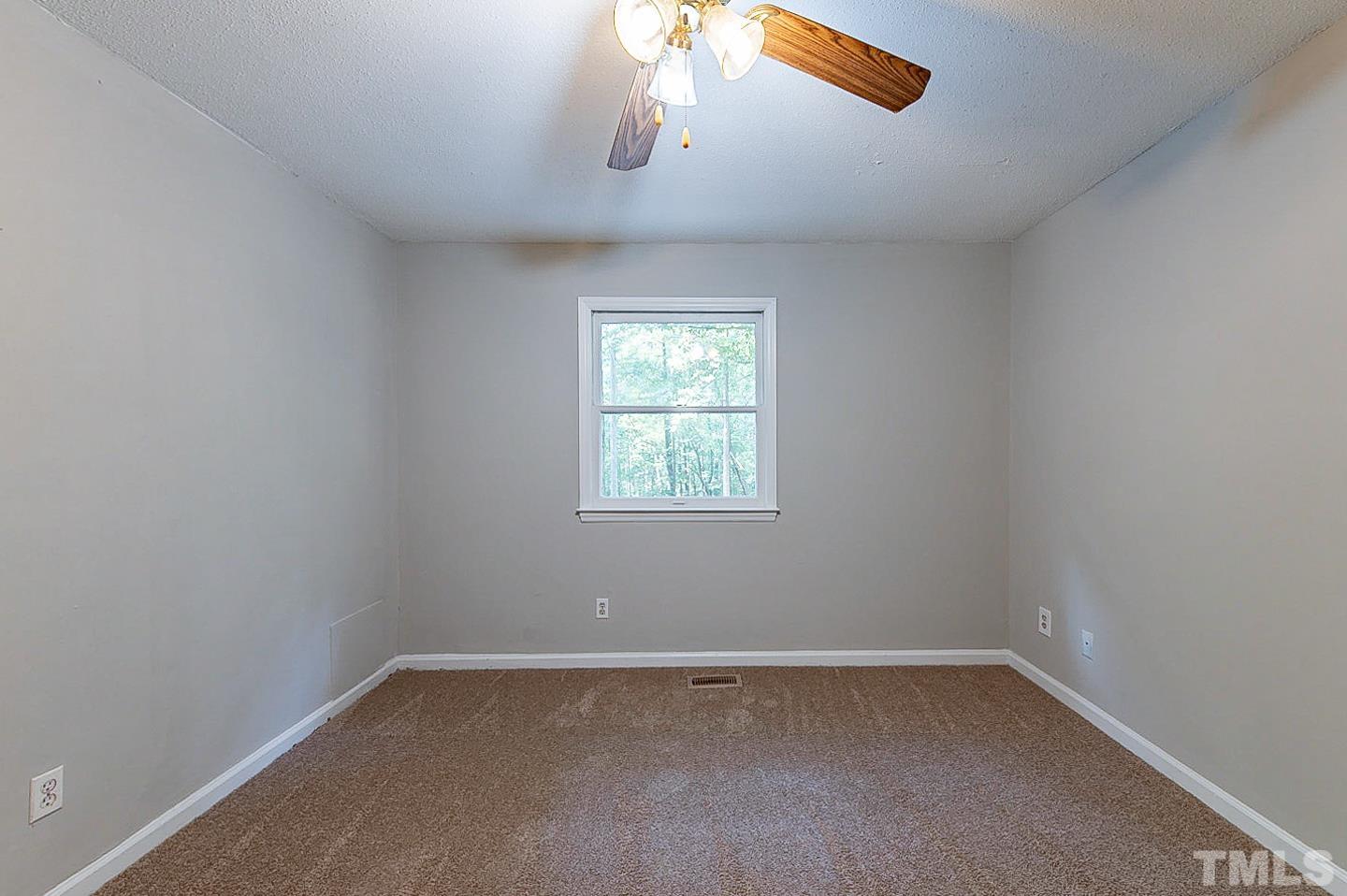 7005 Russell Road Durham, NC 27712 - Photo 14 of 24 an empty room with a window