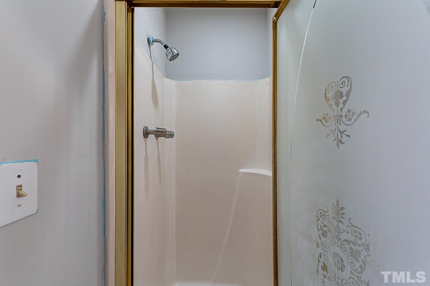 7005 Russell Road Durham, NC 27712 - Photo 19 of 24 a bathroom with a shower
