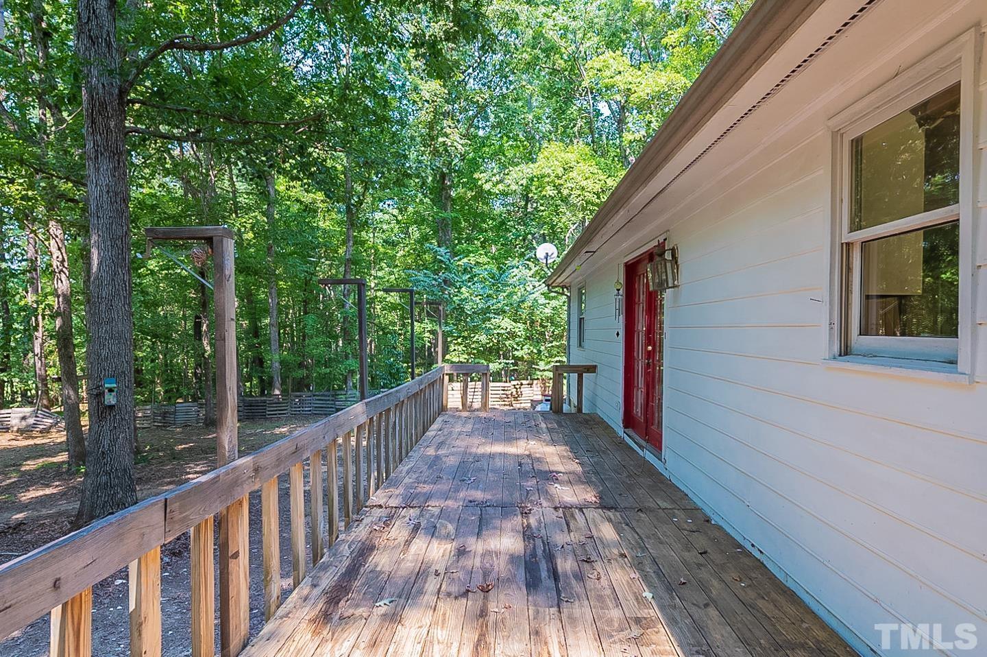 7005 Russell Road Durham, NC 27712 - Photo 20 of 24 a view of a pathway of a house with wooden floor
