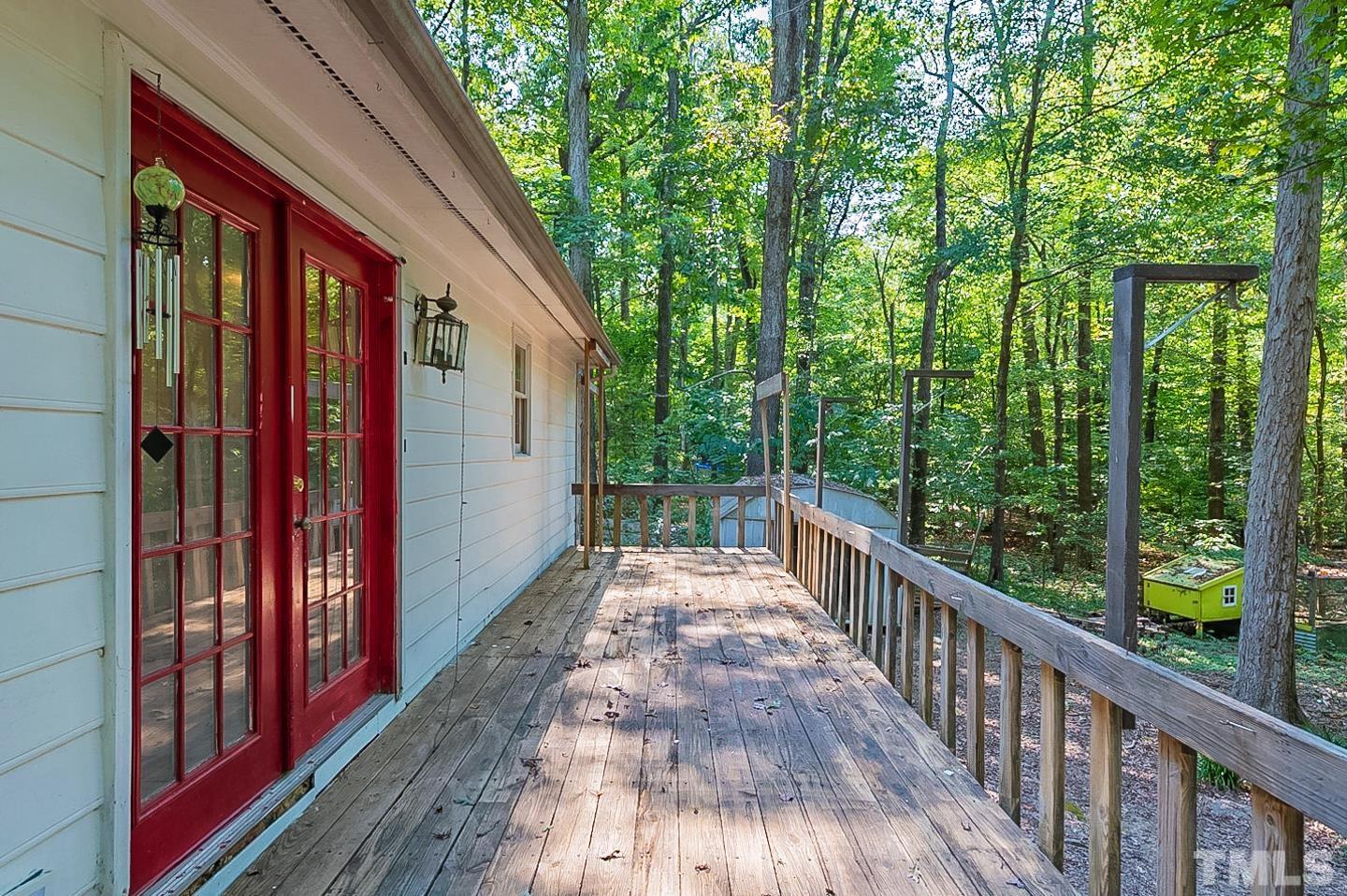 7005 Russell Road Durham, NC 27712 - Photo 21 of 24 a view of a pathway of a house with backyard and balcony
