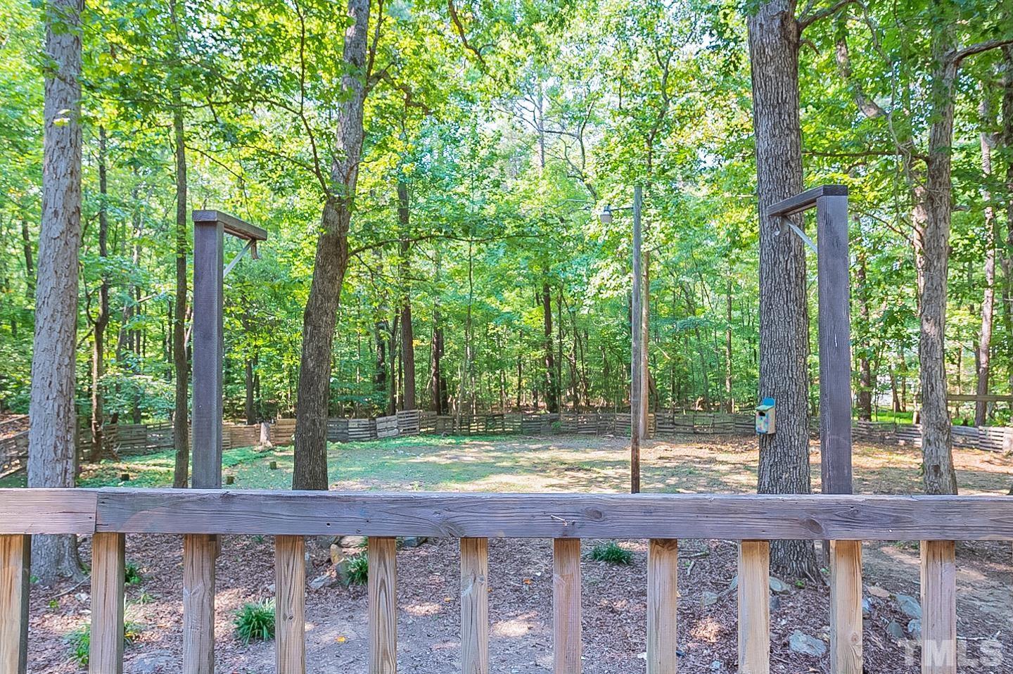 7005 Russell Road Durham, NC 27712 - Photo 23 of 24 a view of a wooden fence next to a yard