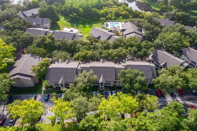 an aerial view of a house with a yard and garden