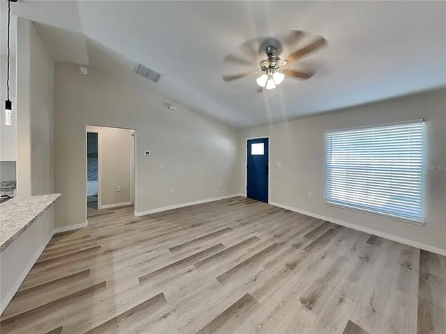 a view of an empty room with a window