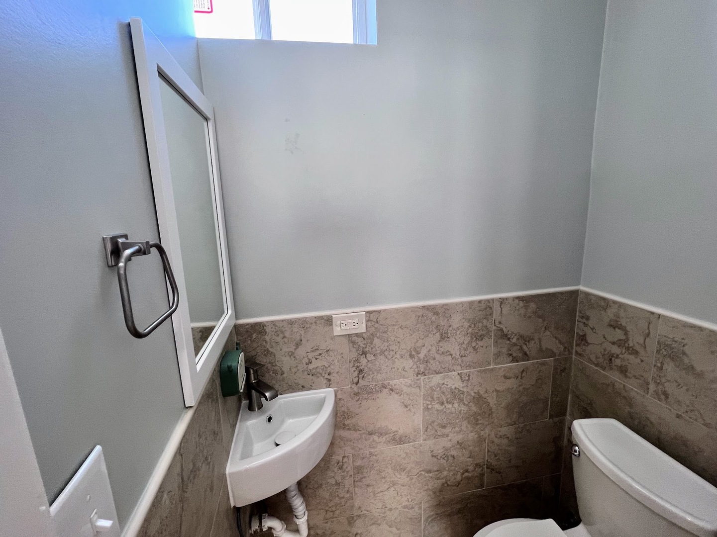 4244 North Spaulding Avenue, Unit 3 Chicago, IL 60618 - Photo 15 of 16 a bathroom with a sink mirror and toilet