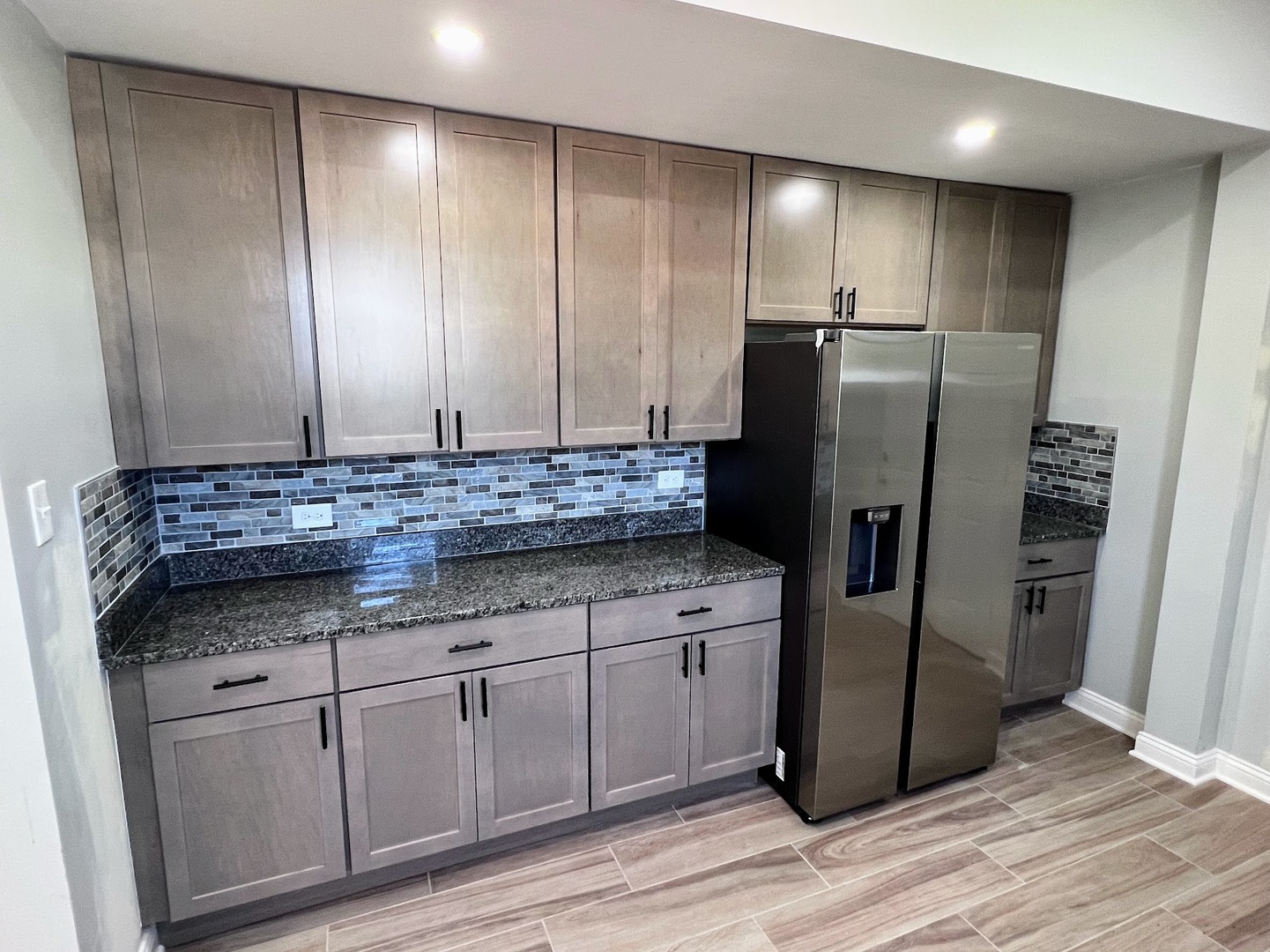 4244 North Spaulding Avenue, Unit 3 Chicago, IL 60618 - Photo 4 of 16 a kitchen with stainless steel appliances granite countertop a refrigerator and a sink