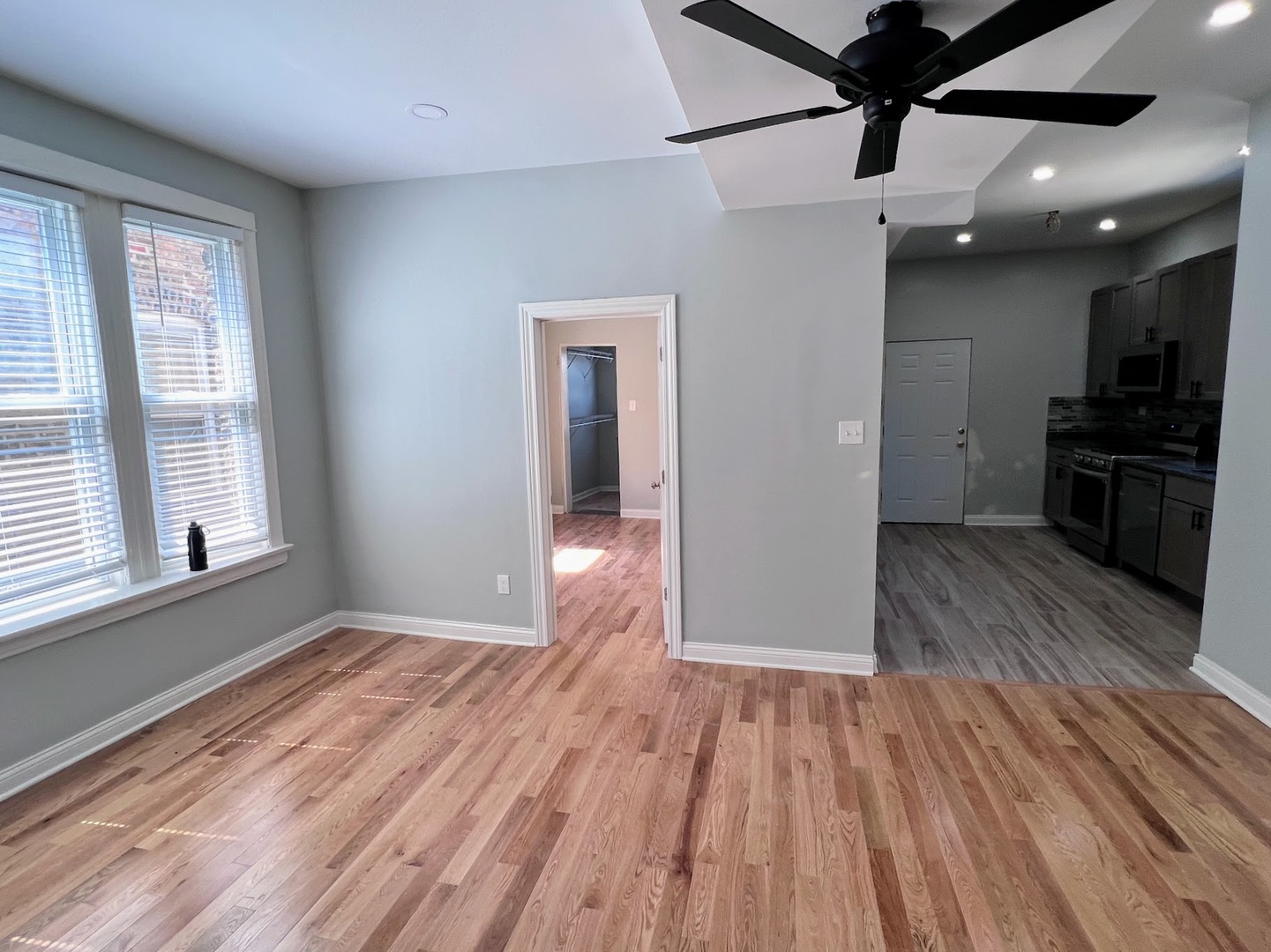 4244 North Spaulding Avenue, Unit 3 Chicago, IL 60618 - Photo 5 of 16 a view of a room with wooden floor and a ceiling fan
