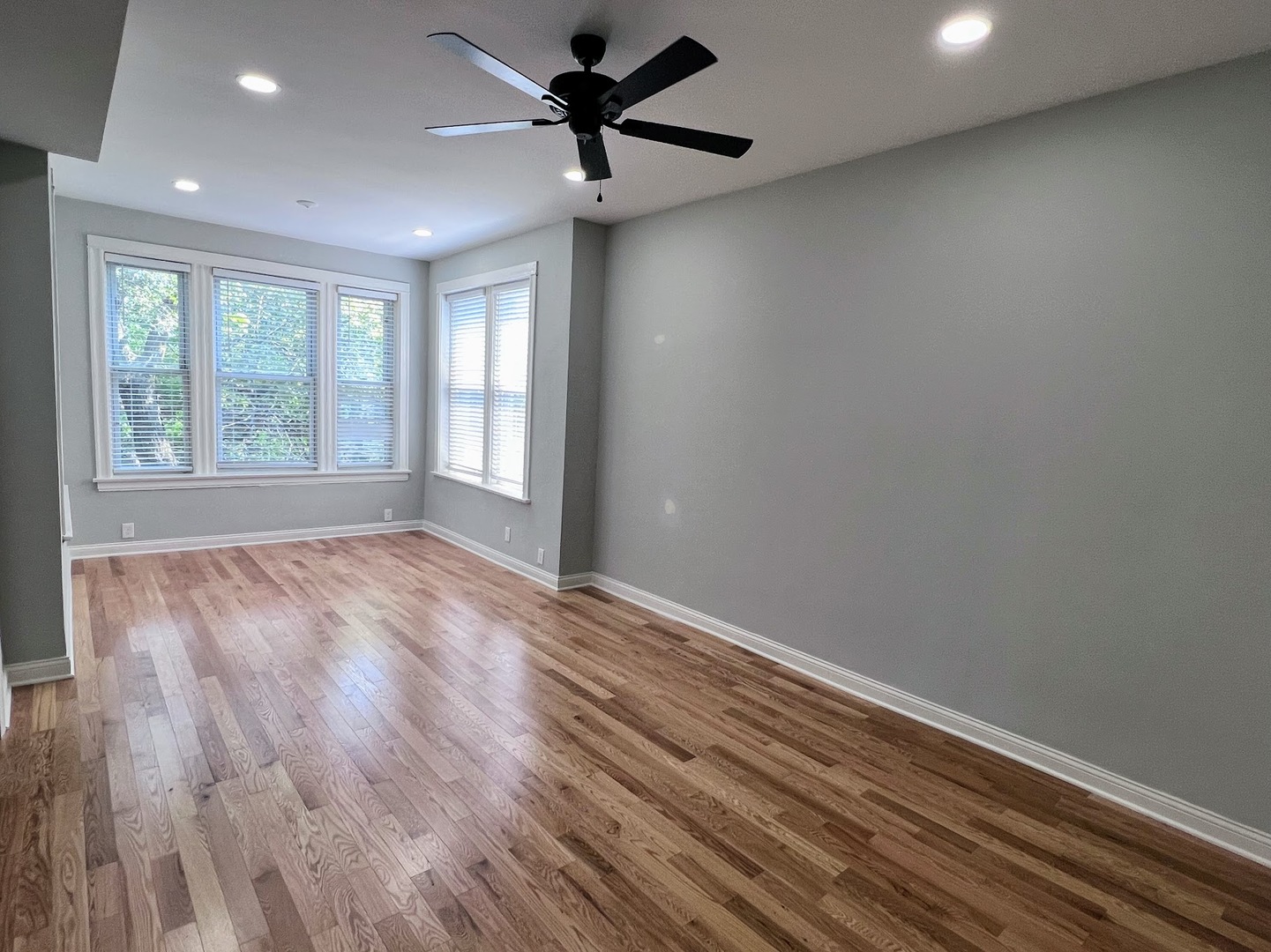 4244 North Spaulding Avenue, Unit 3 Chicago, IL 60618 - Photo 7 of 16 wooden floor in an empty room with a window
