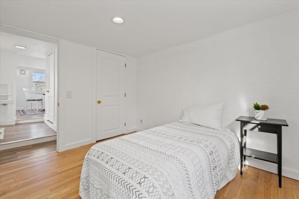 2 Nonantum Road Marblehead, MA 01945 - Photo 12 of 19 a bedroom with a bed and wooden floor