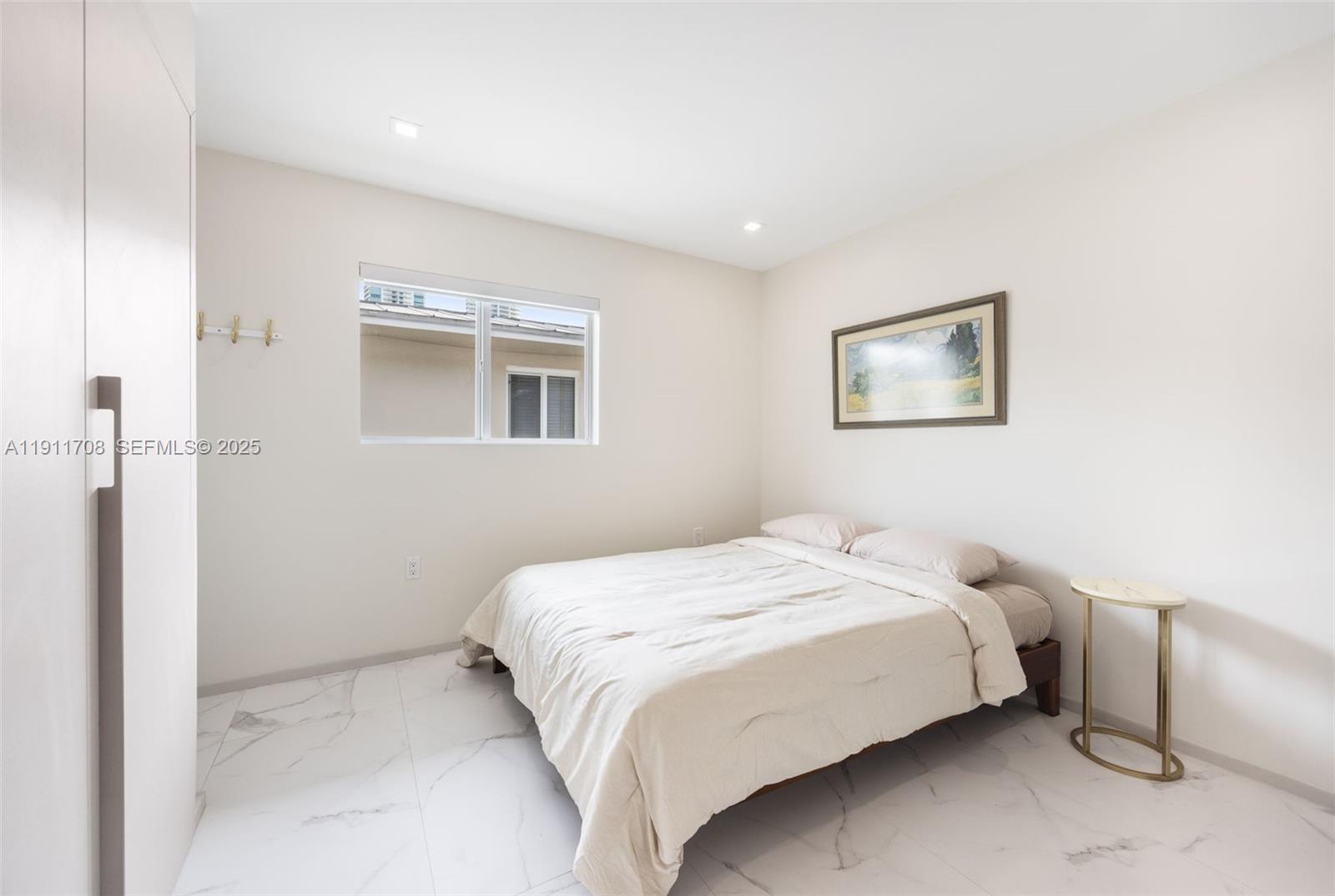 47 Southwest 21st Road Miami, FL 33129 - Photo 20 of 28 a bedroom with a bed and a painting