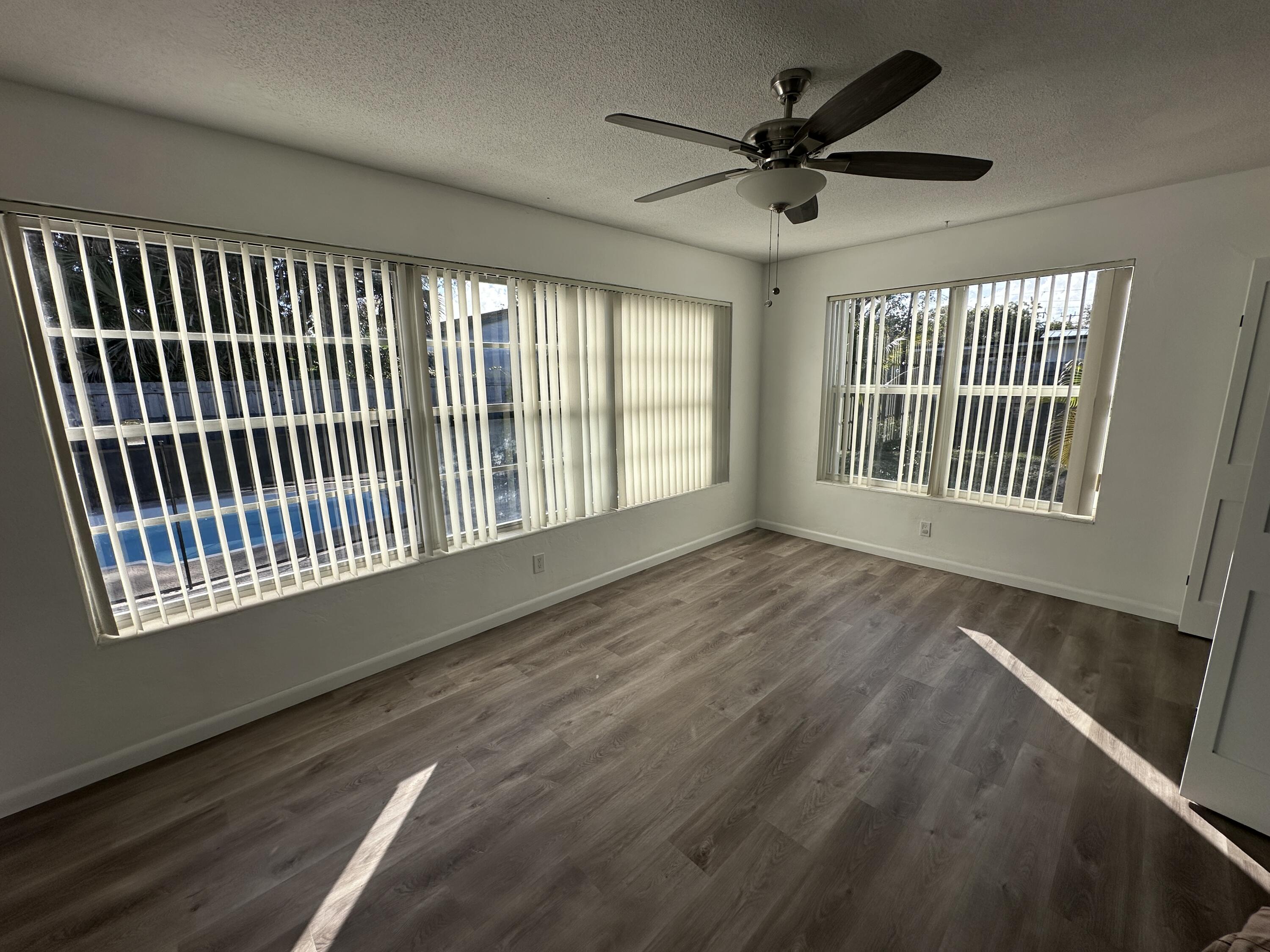 14 Ridgewood Circle Tequesta, FL 33469 - Photo 14 of 24 a view of an empty room with a window