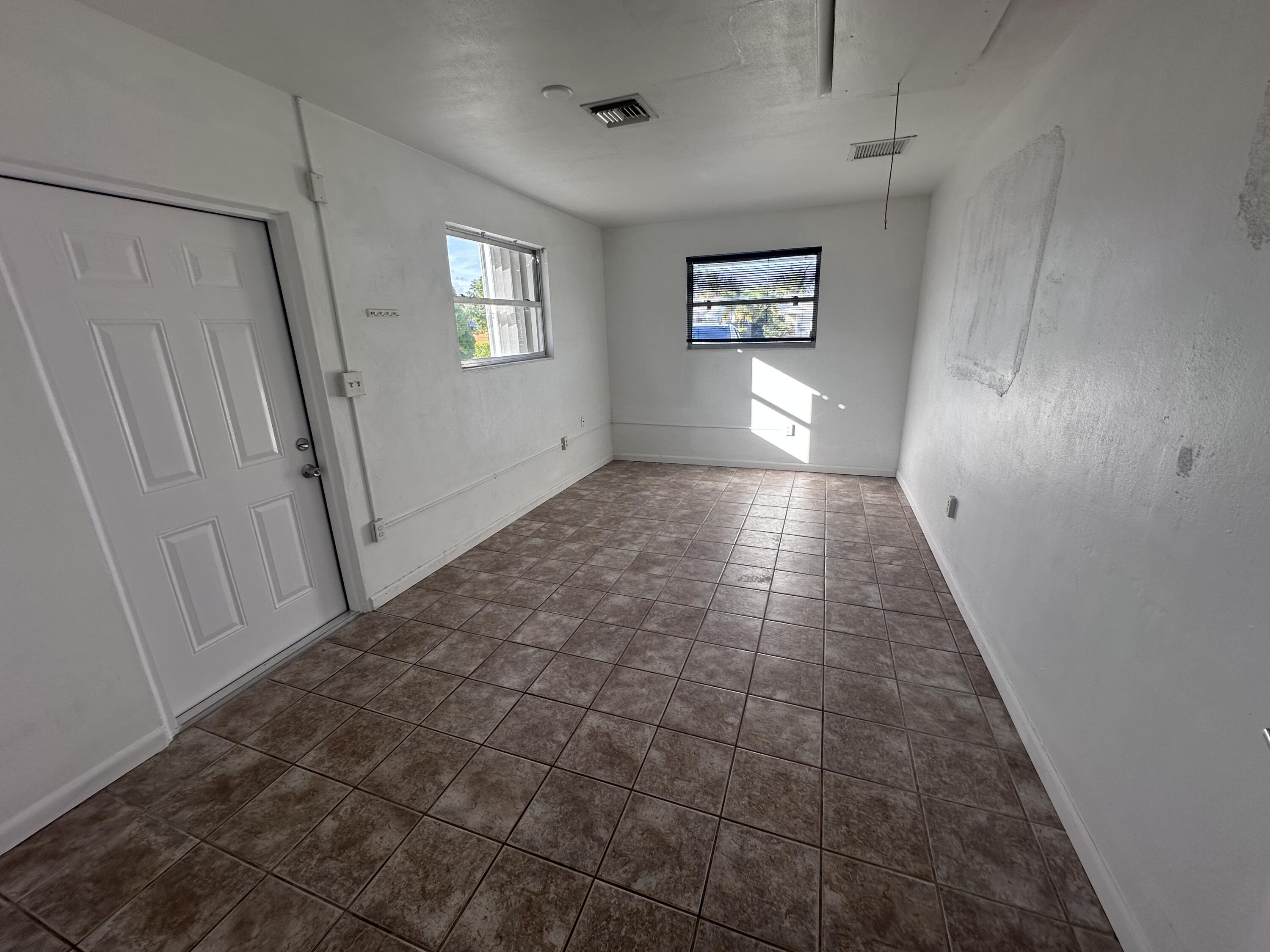 14 Ridgewood Circle Tequesta, FL 33469 - Photo 16 of 24 a view of an empty room and window