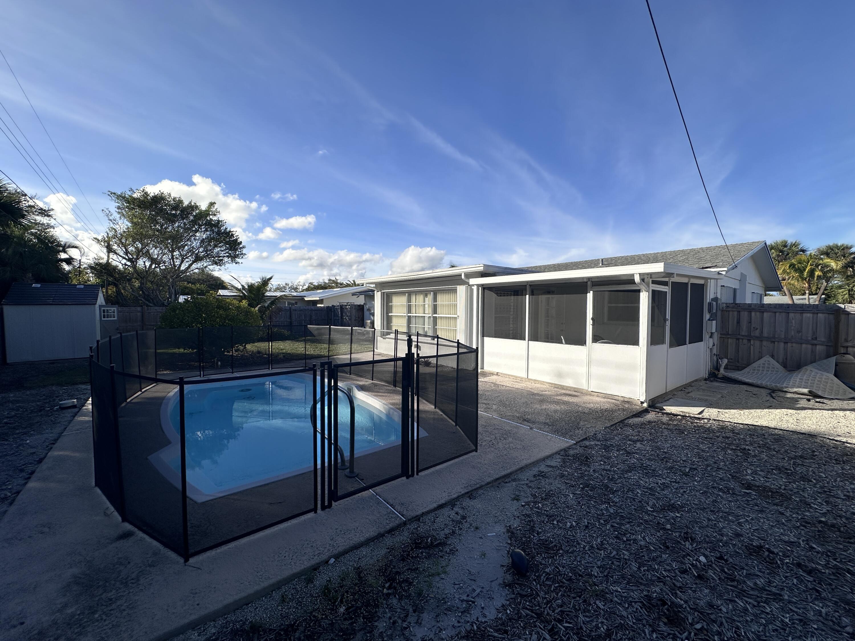 14 Ridgewood Circle Tequesta, FL 33469 - Photo 18 of 24 a view of house with backyard and kitchen