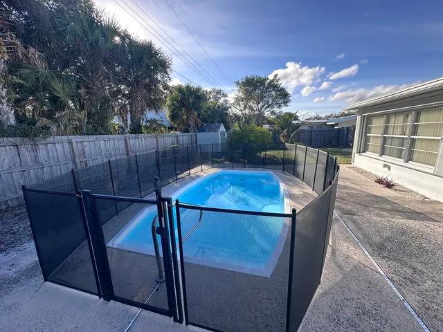 a view of a balcony with table and chairs