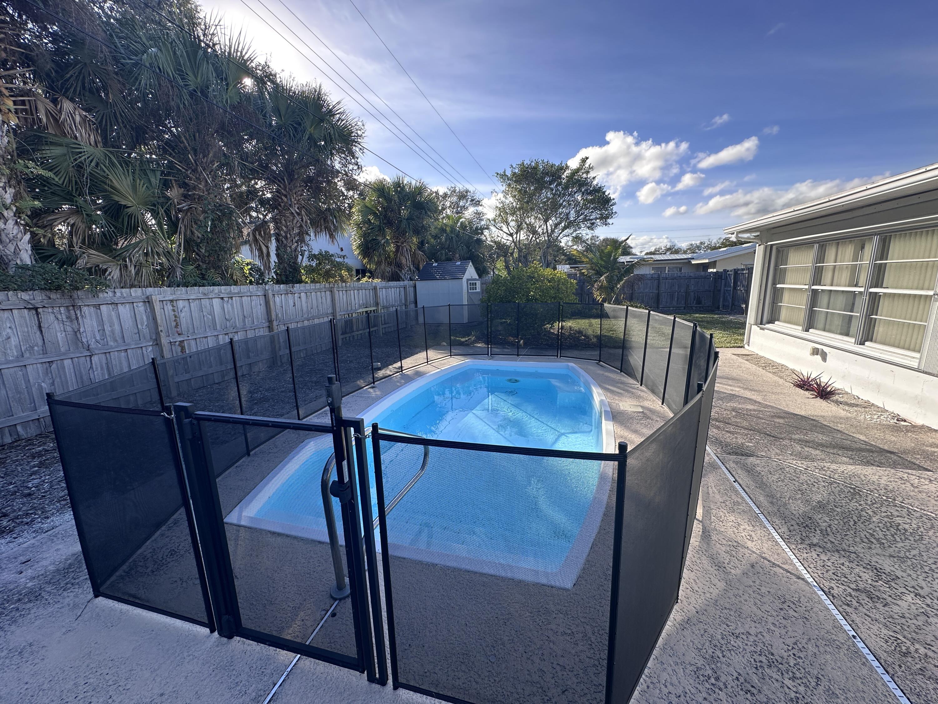 14 Ridgewood Circle Tequesta, FL 33469 - Photo 19 of 24 a view of a balcony with table and chairs