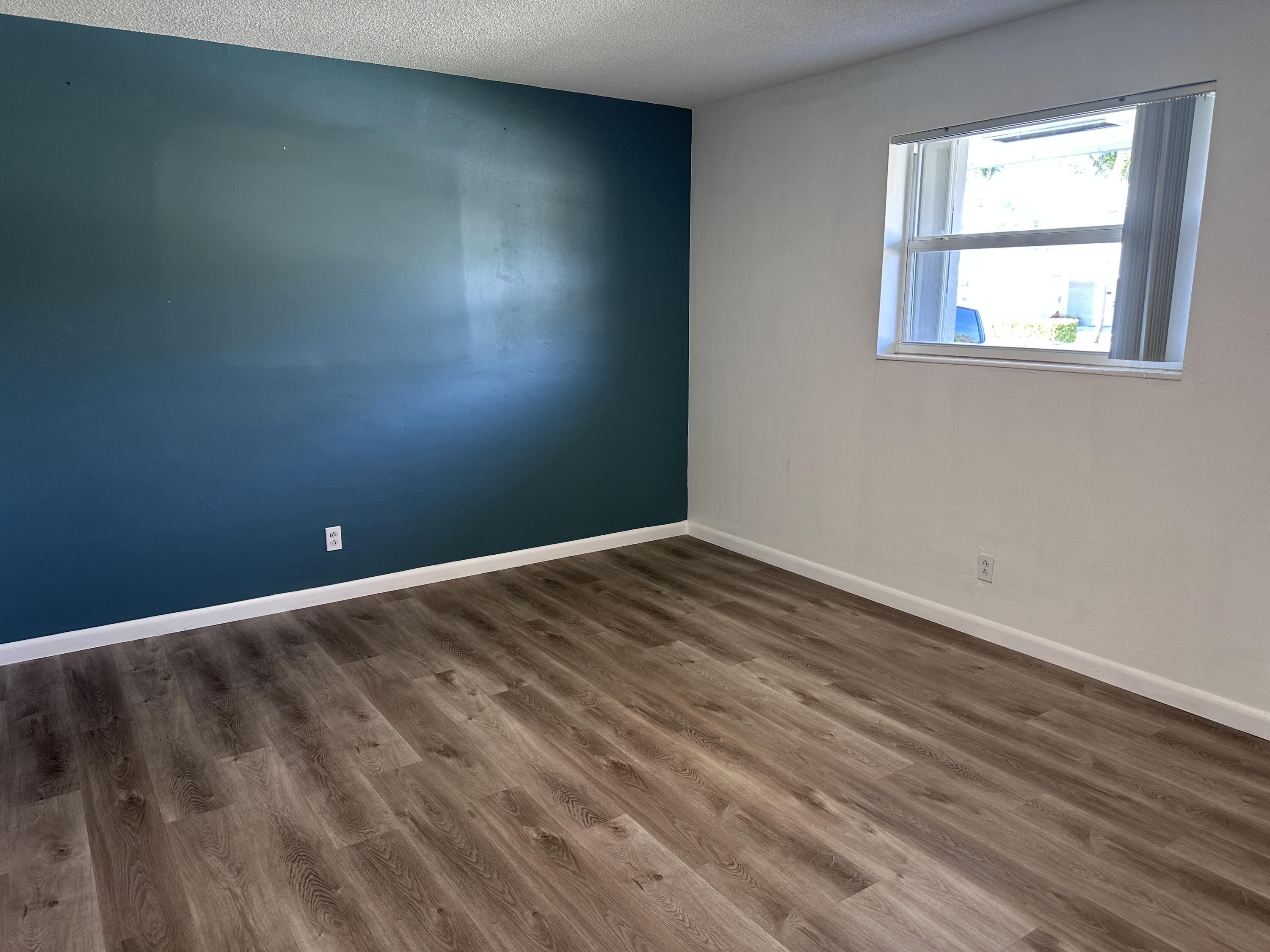 14 Ridgewood Circle Tequesta, FL 33469 - Photo 7 of 24 an empty room with a window