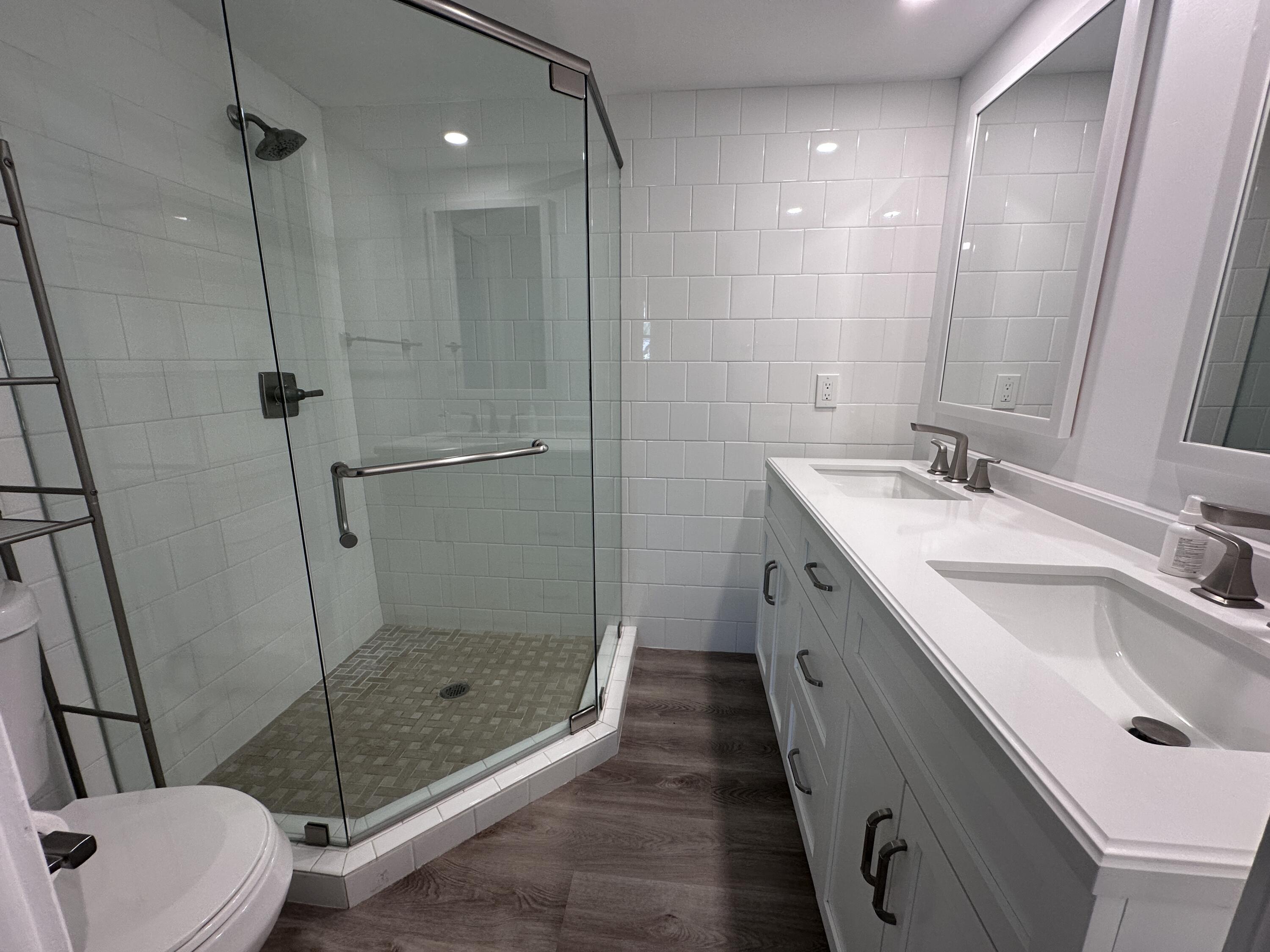 14 Ridgewood Circle Tequesta, FL 33469 - Photo 9 of 24 a bathroom with a double vanity sink toilet and shower