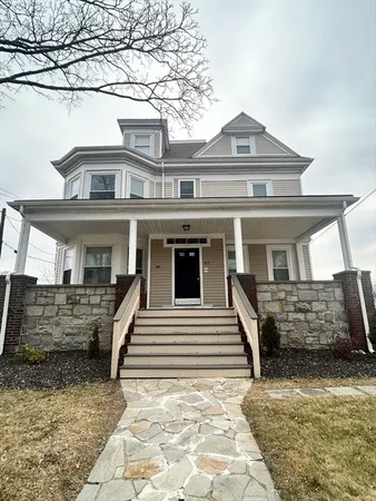 a front view of a house with a garage