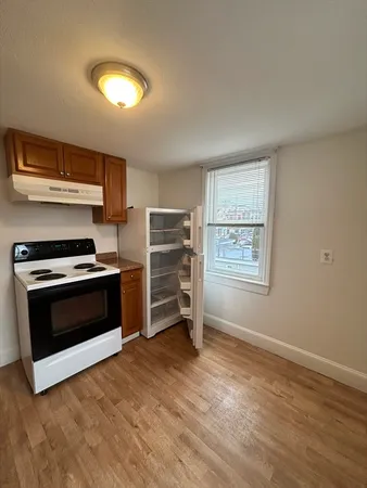 a kitchen with stainless steel appliances a stove and a refrigerator