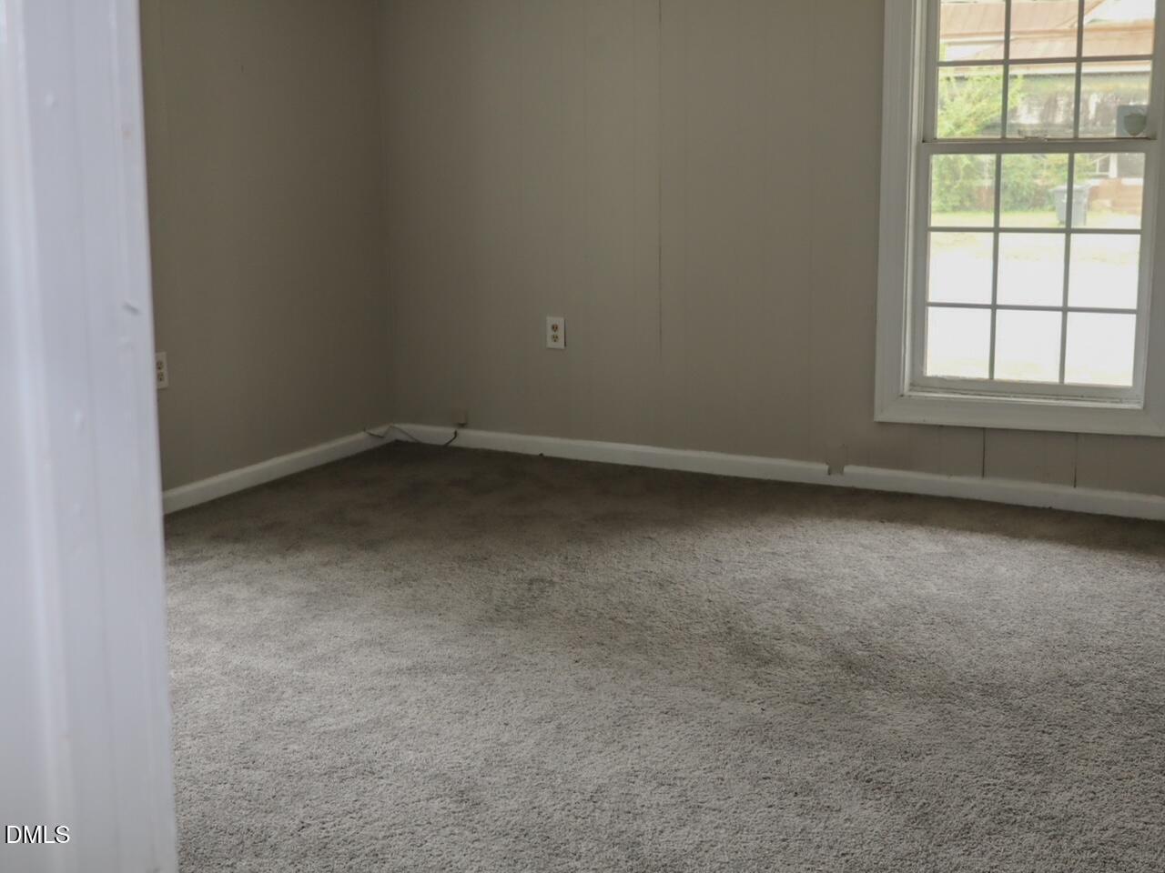 240 East Raleigh Boulevard Rocky Mount, NC 27801 - Photo 11 of 23 an empty room with a window